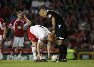 Ben Watson places the ball on the penalty spot Ben Watson places the ball on the penalty spot